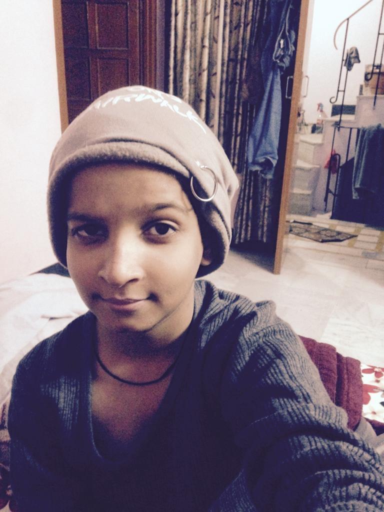 A childhood portrait in a winter cap